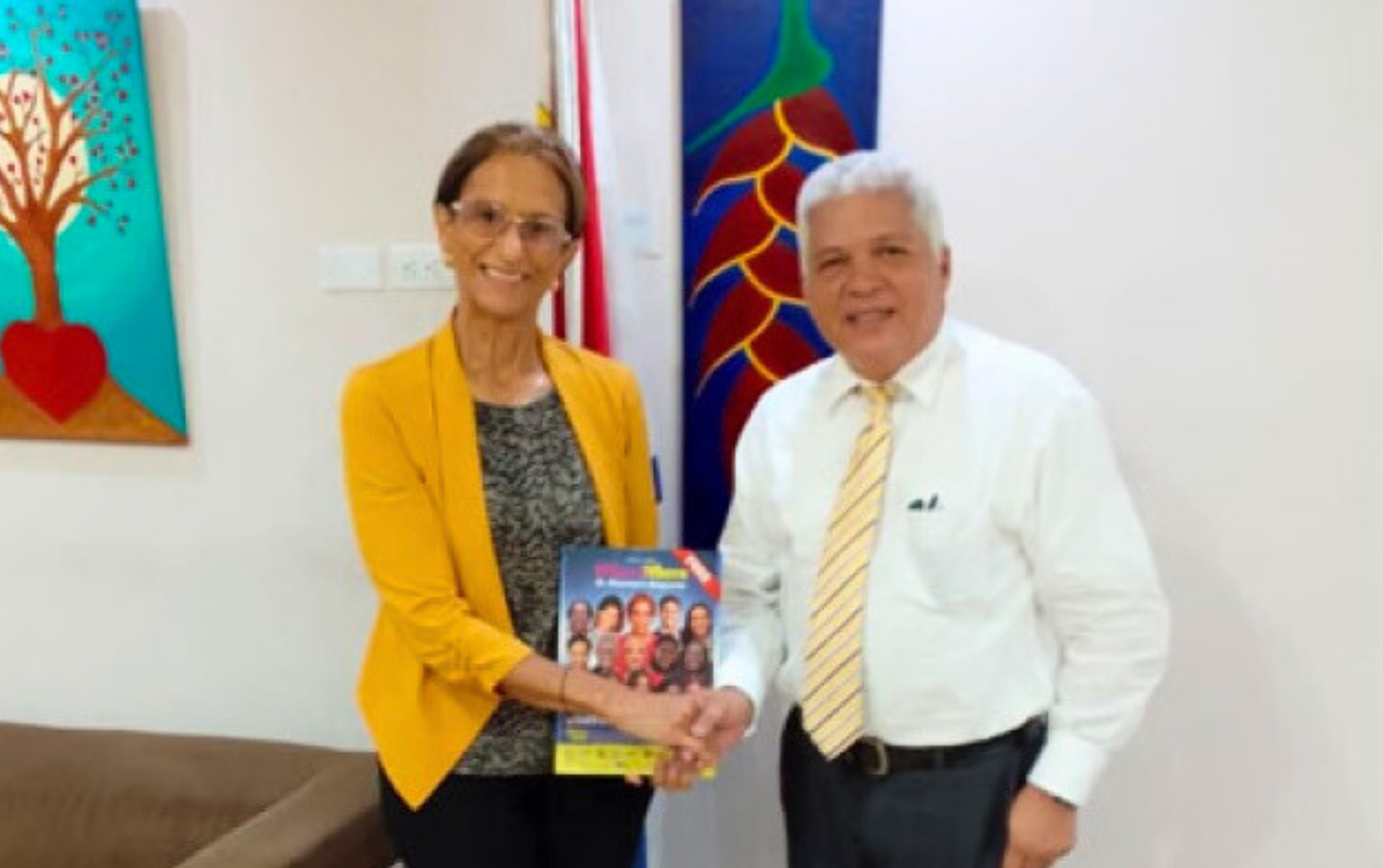 Photo of Robert Espitia and Sarah Holding a Magazine